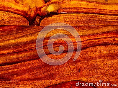 that acacia timber, trim with rosewood red wooden background Stock Photo