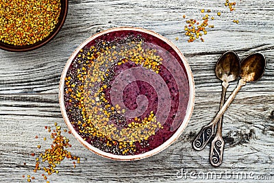 Acai breakfast superfoods smoothies bowl with chia seeds, bee pollen toppings. Immune boosting, anti inflammatory smoothie Stock Photo