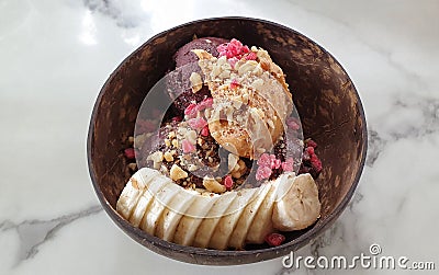 Acai superfood dessert bowl nutty mix Stock Photo