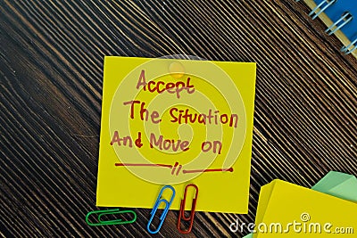 Accept the situation and move on write on sticky notes isolated on Wooden Table. Motivation concept Stock Photo