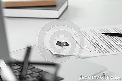 Acceptance letter from university and laptop on white table indoors, focus on paper Stock Photo