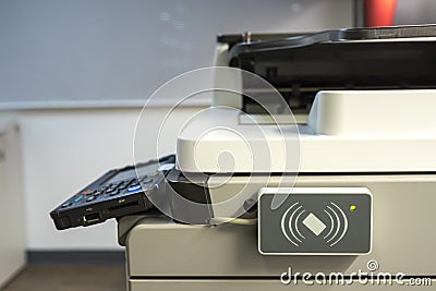 Access control for scanning key card to access Photocopier Stock Photo