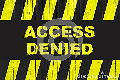 Access denied warning sign with yellow and black stripes painted over cracked wood. Stock Photo