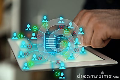 Access to documents. Man using tablet. Scheme over device Stock Photo