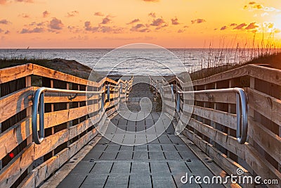 Accessible Boardwalk to Ocean at Sunrise in Salvo NC Stock Photo