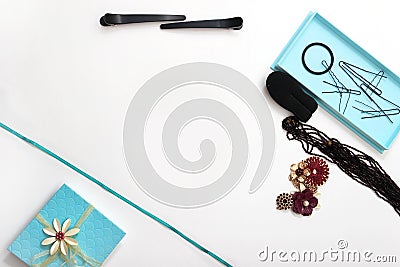 Accessories and hair pins flat lay. Sponge for hair, hairdo babette. necklaces of beads or flowers, tiffany blue boxes made of Stock Photo