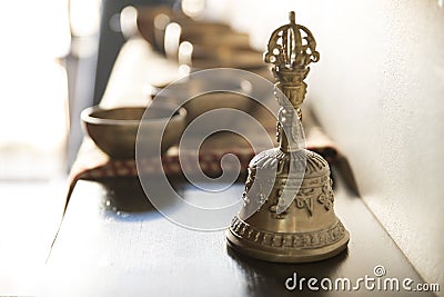 Accessories for sound massage. Tibetan singing bowls and bell for treatment Stock Photo