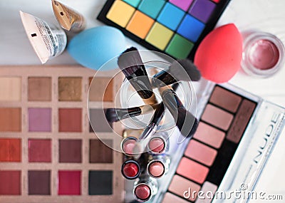 Accessories to a make-up on a gray table. Top view Stock Photo