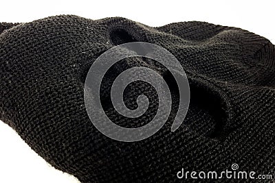 Close Up Black Balaclava Terrorist Mask And a white backdrop Stock Photo