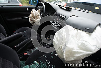 Accident damaged car with opened airbag Stock Photo