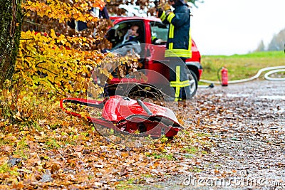 Accident - Fire brigade rescues Victim of a car Stock Photo