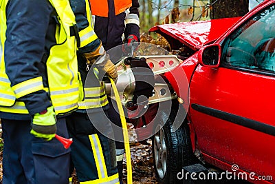 Accident, Fire brigade rescues Victim of a car Stock Photo