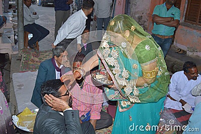 According to the old customs, a marriage ceremony among Hindus in which the sister welcomes her brother by applying tilak of kumku Editorial Stock Photo