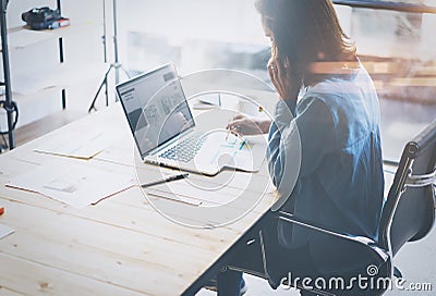 Account manager working process.Young business woman work with new startup project in office.Analyze document, plans Stock Photo