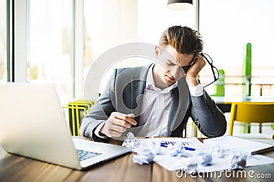 Accountant businessman working with documents in office having a stress. Stock Photo