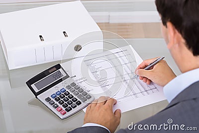 Accountant calculating finances Stock Photo