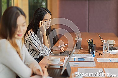 Accountant contact with business client on mobile phone in the office room Stock Photo