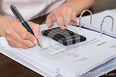 Accountant doing calculation Stock Photo