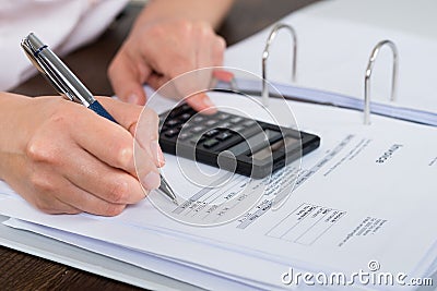 Accountant Doing Calculation Stock Photo