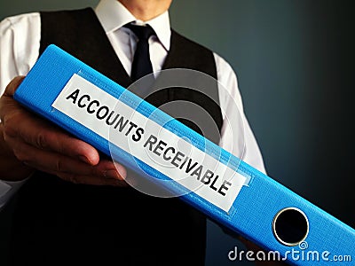 Accountant is holding Accounts Receivable in the folder Stock Photo