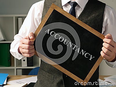 Accountant with inscription accountancy. Stock Photo