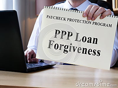 Accountant shows form for PPP loan forgiveness. Stock Photo