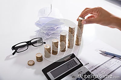 Accountant Stacking Coins Stock Photo