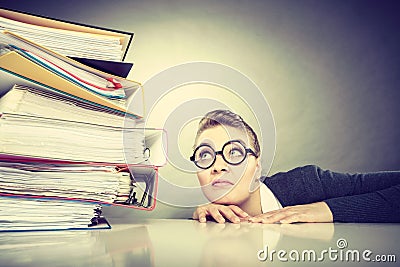 Accountant terrified of pils of binders. Stock Photo