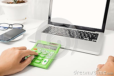 Accountant working and analyzing financial calculating with calculator Stock Photo