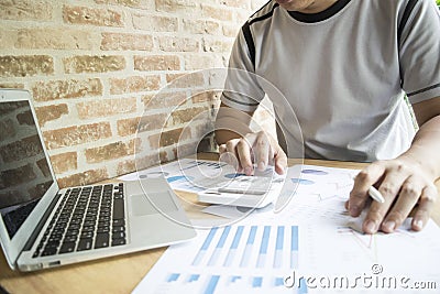 Accountants are examining the company`s finances to prepare business development plans for East Asia. Stock Photo