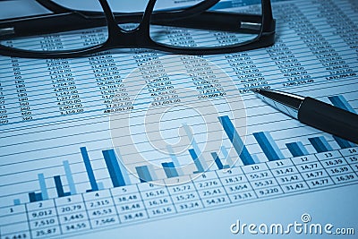 Accounting financial bank banking account stock spreadsheet data with glasses in blue accountant Stock Photo