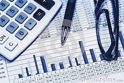 Accounting financial bank banking banker account stock spreadsheet data with glasses pen and calculator in blue Stock Photo