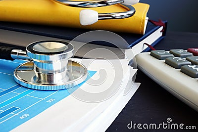 Accounting. Stethoscope and financial report with statistics. Analytic research. Stock Photo