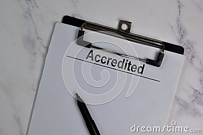 Accredited write on a paperwork isolated on office desk Stock Photo