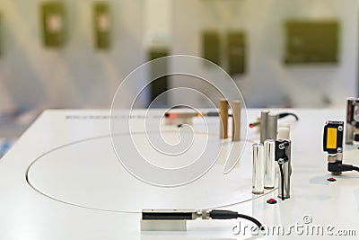 Accuracy mini proximity sensor for detect material moveing for industrial work on table Stock Photo