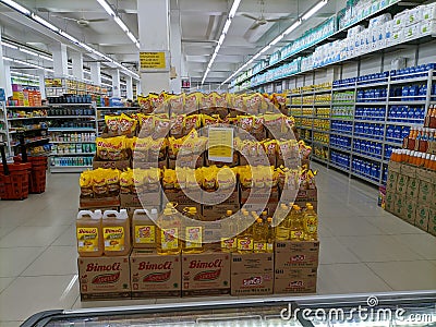 Aceh, Indonesia - 23 July 2023: Aisle view of shelf products and people shopping Editorial Stock Photo