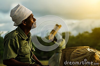 Old man kneels, looking up at the sky and prays Editorial Stock Photo