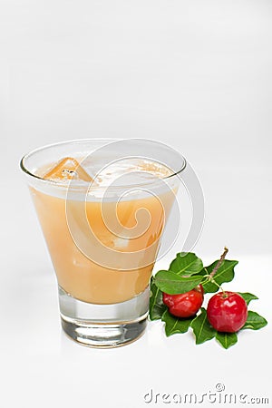 Acerola juice in white background Stock Photo