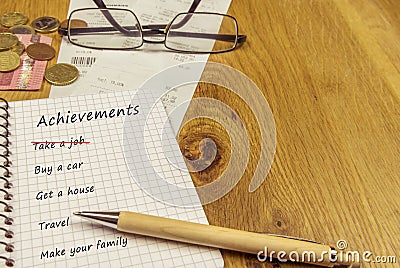 Achievements list in a spiral notebook Stock Photo