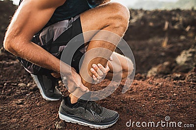 Achilles injury on running outdoors Stock Photo