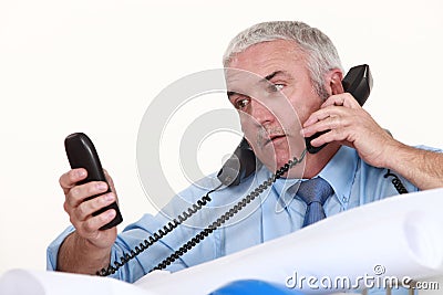 Achitect getting multiple calls Stock Photo