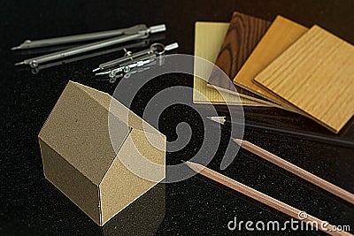 achitect samply materials for home design and construction concept with copy space. pencils and protracters, house and wood Stock Photo