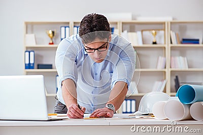 The achitect working on blueprint drawings Stock Photo