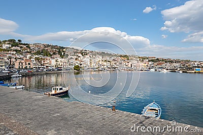 Cityscape of the Aci Trezza city in Sicily with harbour and some small ships and yachts Editorial Stock Photo