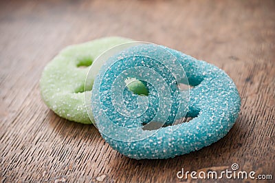 Acidulous candies in shaped smiley on wooden backgrou Stock Photo