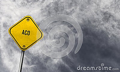 aco - yellow sign with cloudy background Stock Photo