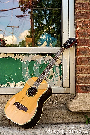 Baritone Ukulele Guitar Sidewalk Stock Photo