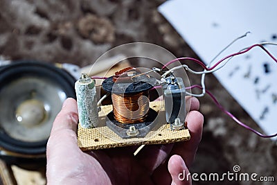 Acoustic filter in a music column. Electrical circuit of a magnetic coil, capacitor and resistance Stock Photo
