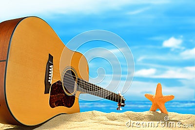 Acoustic guitar on the beach Stock Photo