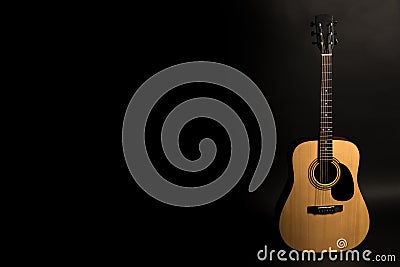 Acoustic guitar on a black background on the right side of the frame. Stringed instrument. Horizontal frame. Stock Photo